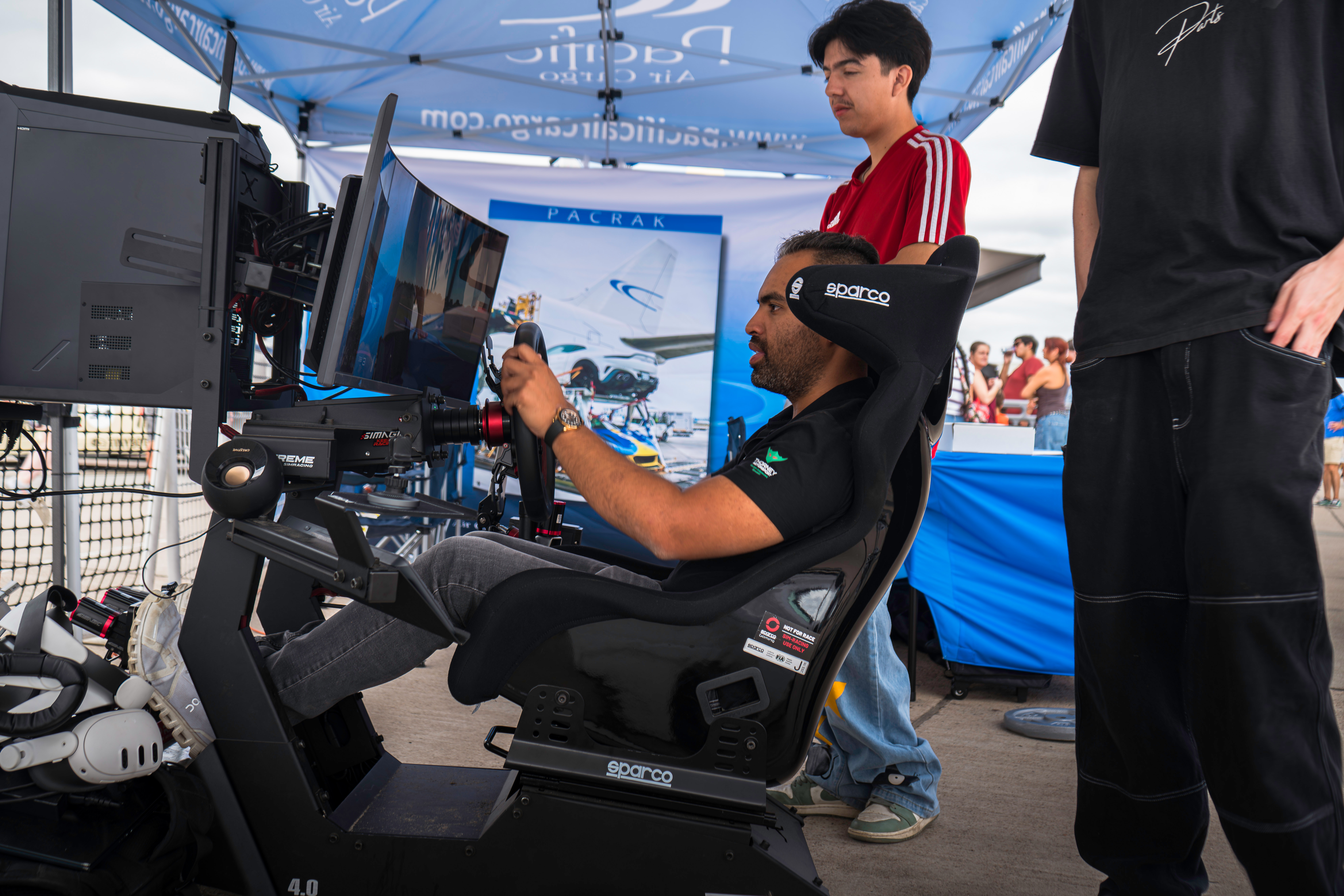 Sim rig demo at outdoor event booth