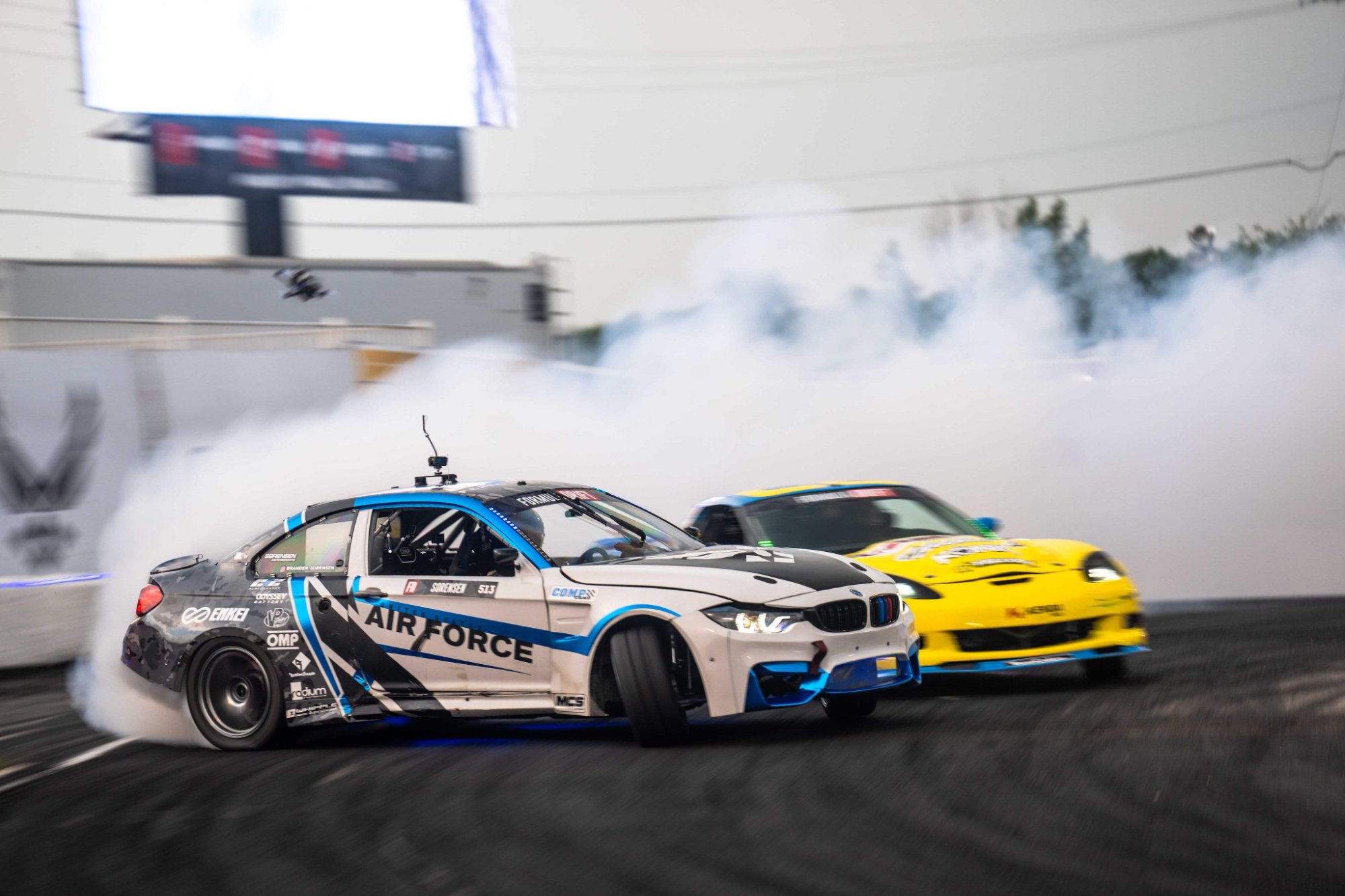 Air Force M4 tandem drifting at night with dramatic lighting