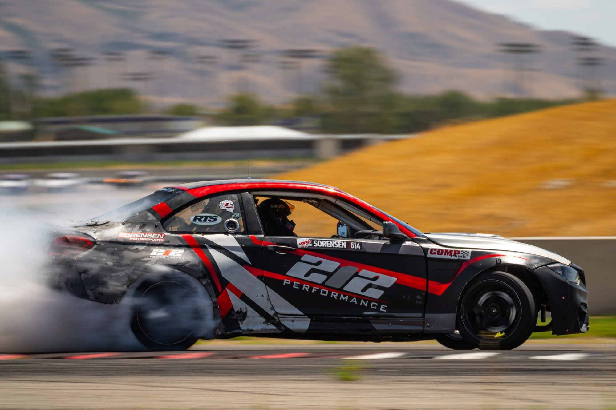 212 Performance Sorensen BMW M4 drifting with mountain backdrop