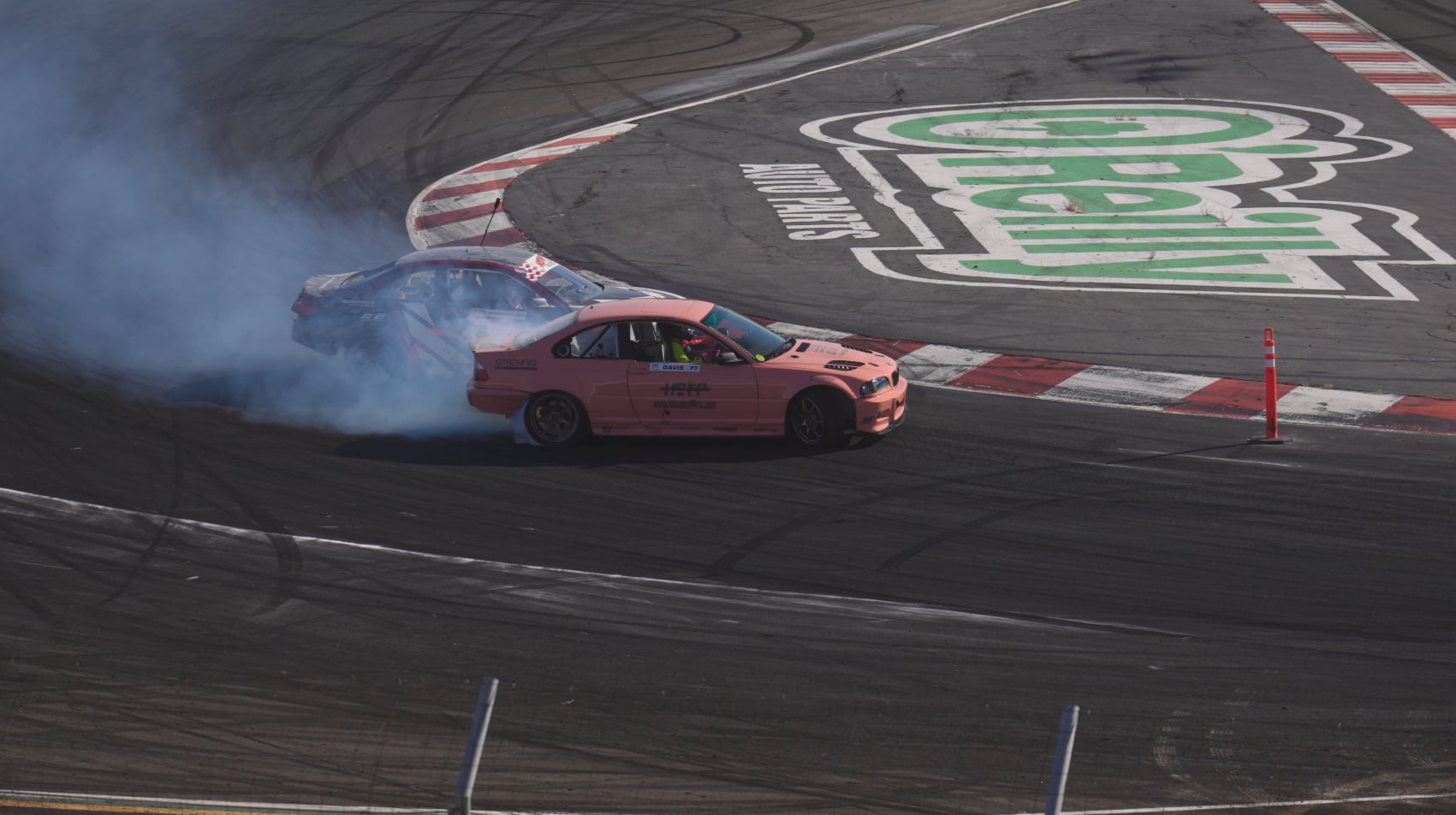 Pink drift car solo run at O'Reilly track with tire smoke
