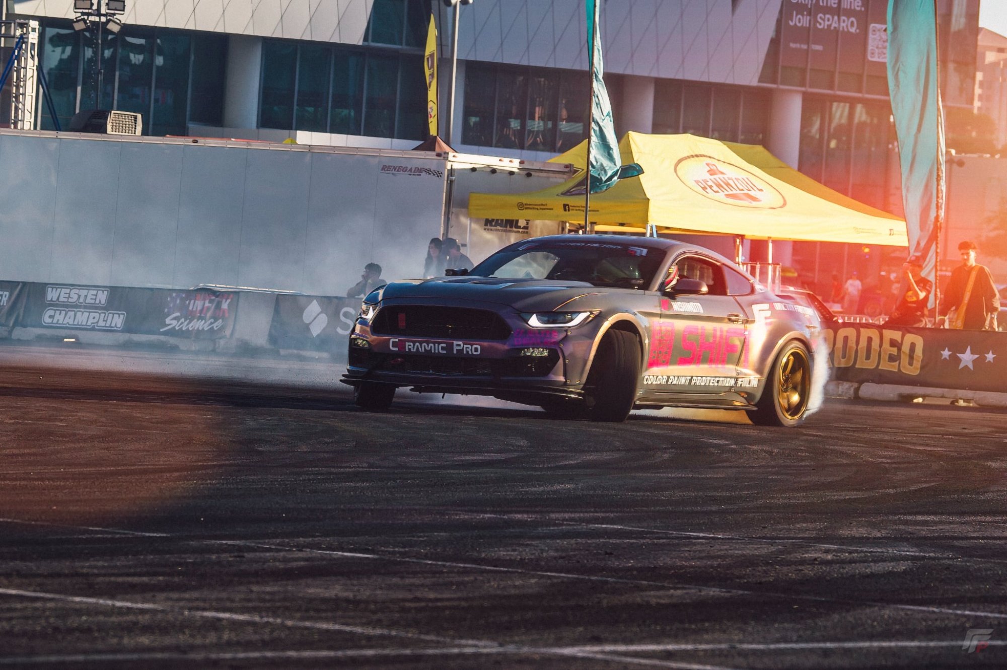 Mustang drifting at Formula Drift venue with Ceramic Pro and Shift livery