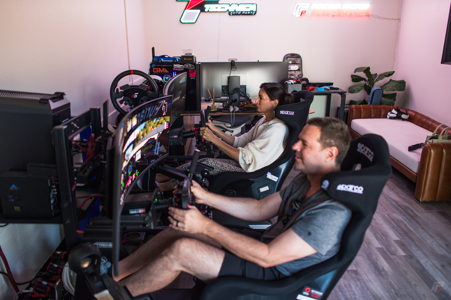 FFP headquarters dual sim racing rigs — side-by-side Simagic cockpits