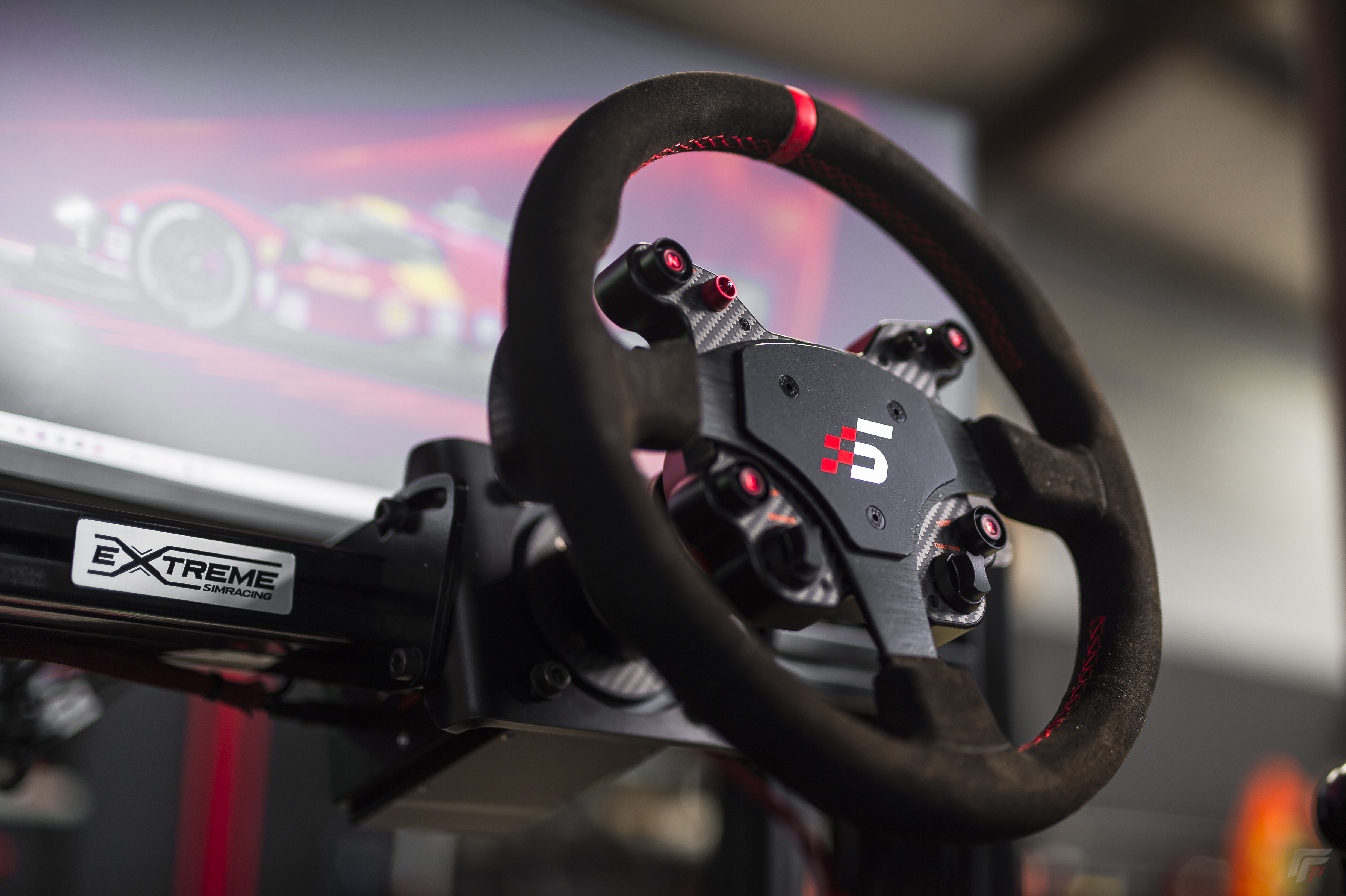 Simagic steering wheel close-up on Extreme Simracing frame