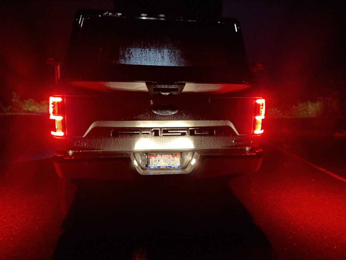 F-150 with both Morimoto XB tail lights illuminated and reverse light at night