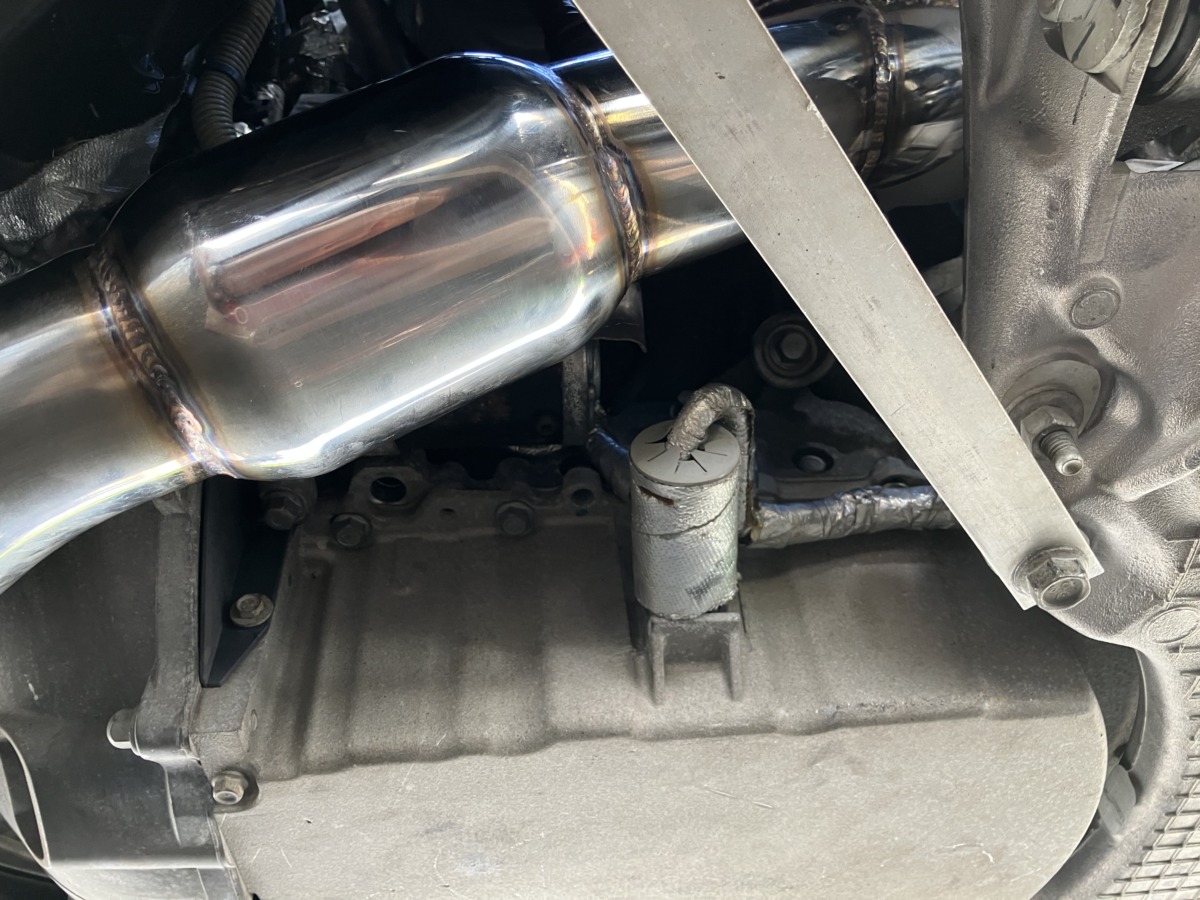 Stainless high-flow downpipe close-up