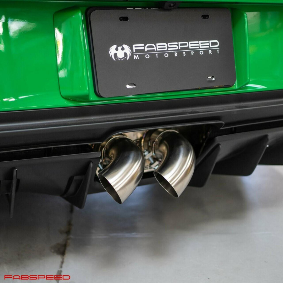 Fabspeed polished tips closeup on green 992 GT3 rear bumper