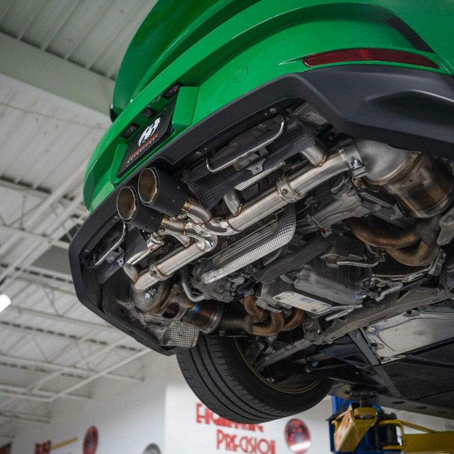 992 GT3 underside view with Fabspeed Valvetronic Cat-Back installed on lift