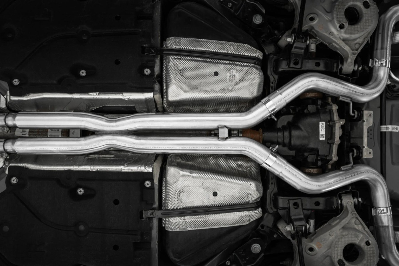 MBRP Armor Pro cat-back exhaust installed - underbody view on the 2024-2026 Mustang GT