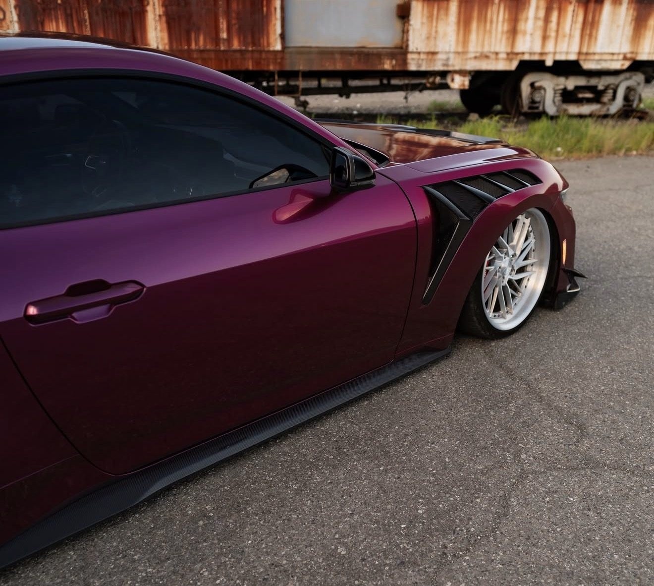 FFP carbon fiber side skirt extension along the rocker of the S650 Mustang